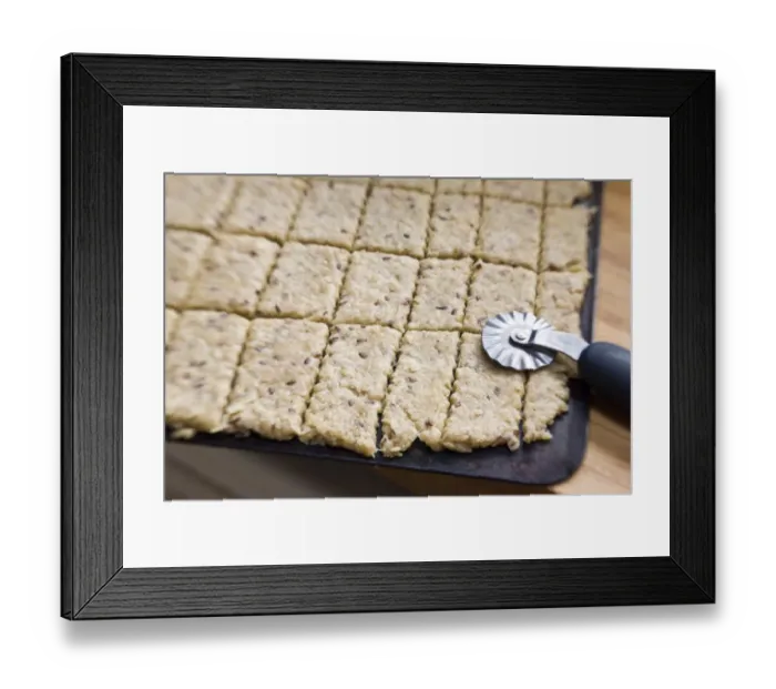 Framed Print : Cookie dough rolled out on baking sheet cut with pastry cutter, before going into oven credit Framed Print : Cookie dough rolled out on baking sheet cut with pastry cutter, before going into oven credit