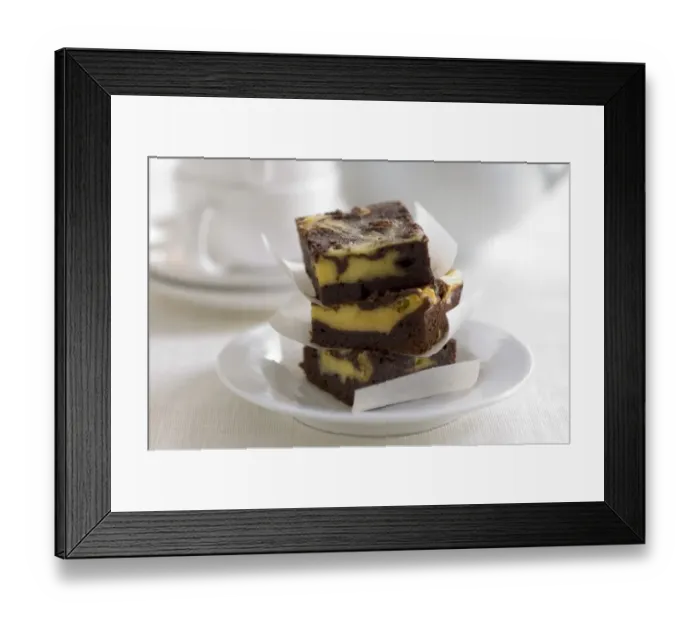 Framed Print : Stacked squares of cheesecake marbled with chocolate credit: Marie-Louise Avery Framed Print : Stacked squares of cheesecake marbled with chocolate credit: Marie-Louise Avery