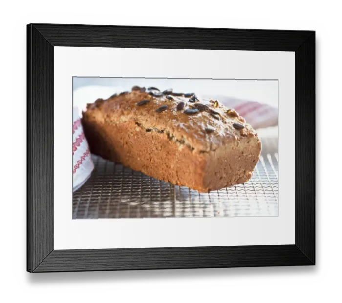 Framed Print : Homemade wholemeal loaf topped with pumpkin seeds, cooling on wire rack credit Framed Print : Homemade wholemeal loaf topped with pumpkin seeds, cooling on wire rack credit