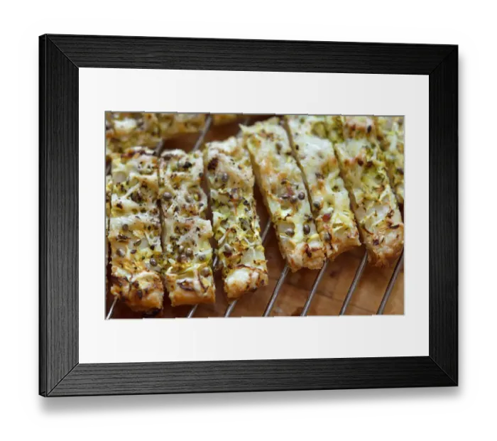 Framed Print : Freshly baked cheese straws cooling on rack, made with grated courgette and grated Framed Print : Freshly baked cheese straws cooling on rack, made with grated courgette and grated