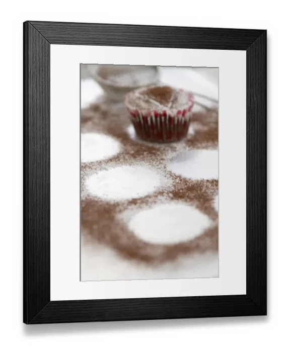 Framed Print : Dusting chocolte muffins with cocoa powder credit: Marie-Louise Avery  /  thePictureKitchen