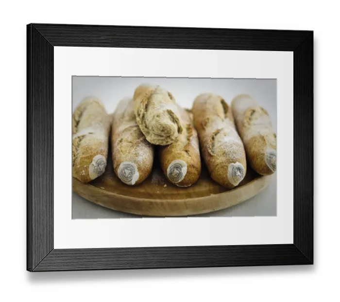 Framed Print : Pile of stoneground wholemeal organic baguettes on woden board credit: Marie-Louise Framed Print : Pile of stoneground wholemeal organic baguettes on woden board credit: Marie-Louise