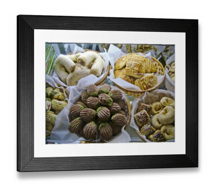 Framed Print : Selection of cakes, cookies and biscuits in display case of patisserie cafe in resort Framed Print : Selection of cakes, cookies and biscuits in display case of patisserie cafe in resort