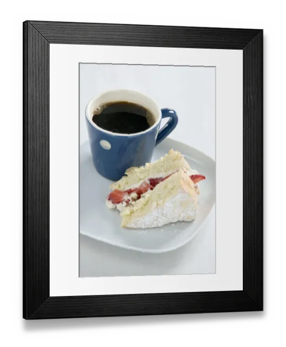 Framed Print : A piece of strawberry sponge cake on a white plate with a small blue and white spotted