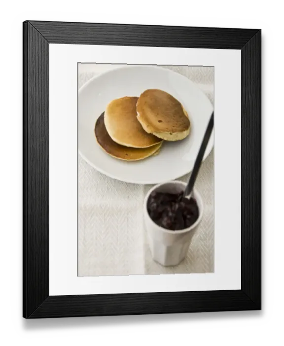 Framed Print : Three Scotch pancakes on a white plate with small pot of raspberry jam credit Framed Print : Three Scotch pancakes on a white plate with small pot of raspberry jam credit