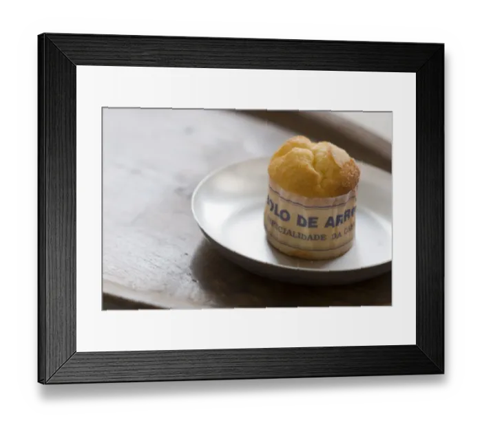 Framed Print : Classic Portuguese muffin type cake made with rice in paper wrapper on metal plate Framed Print : Classic Portuguese muffin type cake made with rice in paper wrapper on metal plate