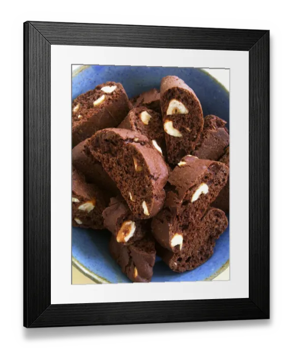 Framed Print : Chocolate and almond cookies in blue ceramic bowl credit: Marie-Louise Avery / Framed Print : Chocolate and almond cookies in blue ceramic bowl credit: Marie-Louise Avery /