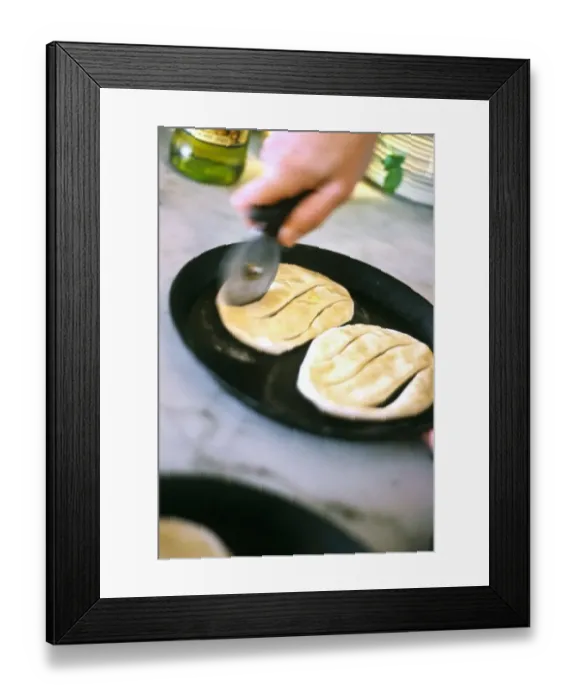 Framed Print : Rolled out pizza dough with olive oil being cut into shape before baking as focaccia bread credit Framed Print : Rolled out pizza dough with olive oil being cut into shape before baking as focaccia bread credit