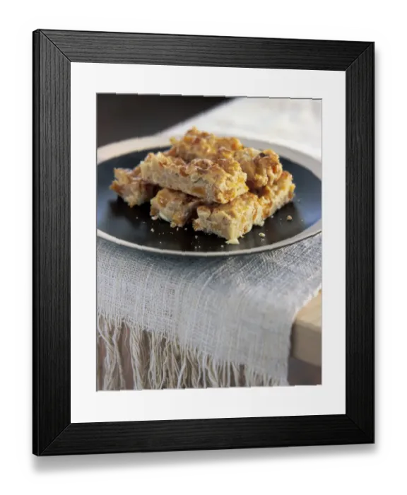 Framed Print : Home made flapjacks stacked on brown plate