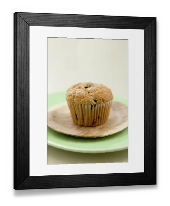 Framed Print : Healthy bran and raisin muffin on small wooden plate on green platter credit: Marie-Louise Framed Print : Healthy bran and raisin muffin on small wooden plate on green platter credit: Marie-Louise