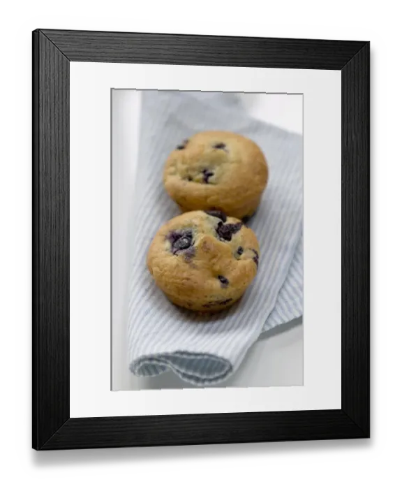 Framed Print : Freshly baked blueberry muffin on blue striped napkin with blue and white china credit Framed Print : Freshly baked blueberry muffin on blue striped napkin with blue and white china credit