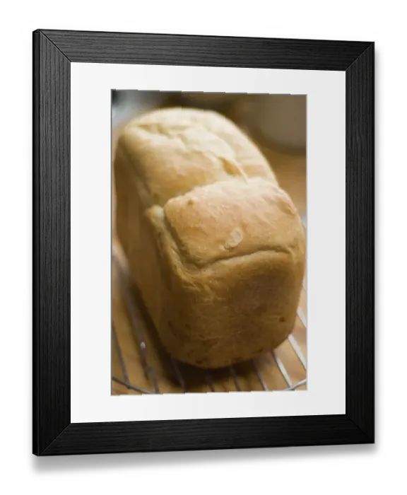 Framed Print : Freshly baked white loaf rack cooling on wire rack credit: Marie-Louise Avery  / 