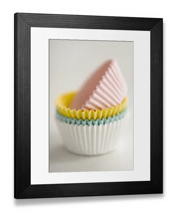 Framed Print : Stack of pastel coloured muffins cases credit: Marie-Louise Avery / thePictureKitchen Framed Print : Stack of pastel coloured muffins cases credit: Marie-Louise Avery / thePictureKitchen