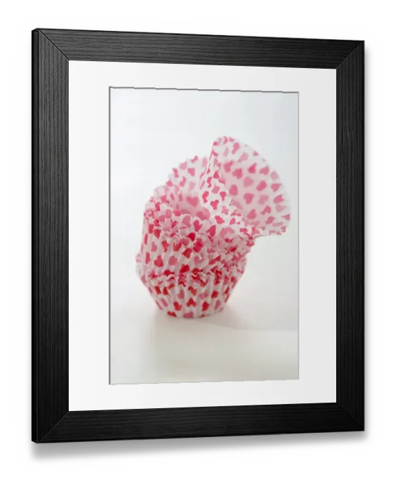 Framed Print : Paper cases for making muffins and fairy cakes - decorated with small red hearts credit Framed Print : Paper cases for making muffins and fairy cakes - decorated with small red hearts credit