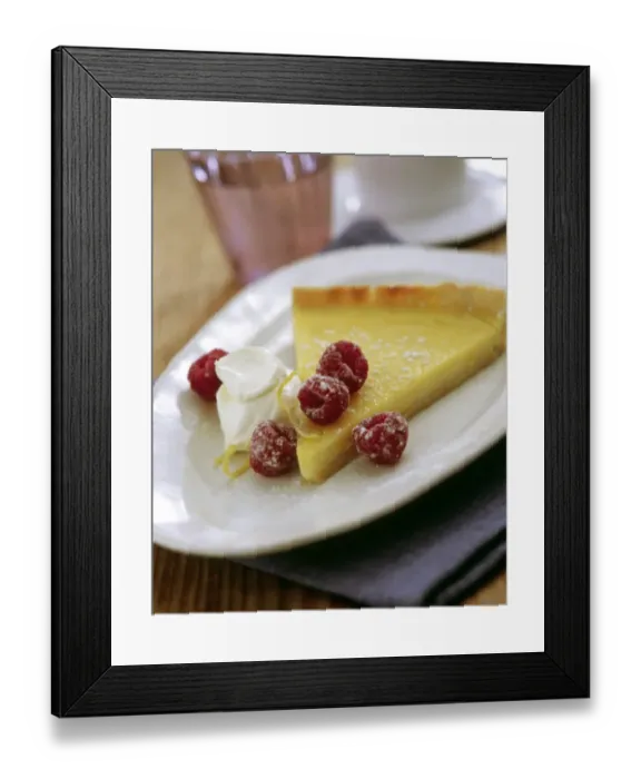 Framed Print : Slice of classic lemon tart served with fresh raspberries, lemon zest and creme fraiche credit Framed Print : Slice of classic lemon tart served with fresh raspberries, lemon zest and creme fraiche credit
