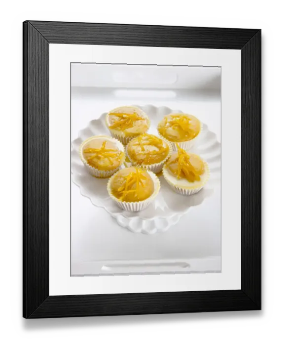 Framed Print : Six lemon drizzle fairy cakes on white cake stand credit: Marie-Louise Avery  /  thePictureKitchen