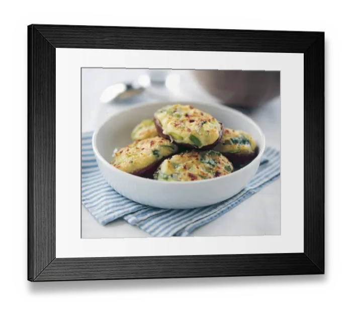 Framed Print : Halved baking potatoes baked with topping of cheese and spring onions credit: Marie-Louise