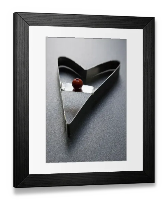 Framed Print : Cookie cutter in modern heart shape with red bead handle credit: Marie-Louise Avery Framed Print : Cookie cutter in modern heart shape with red bead handle credit: Marie-Louise Avery