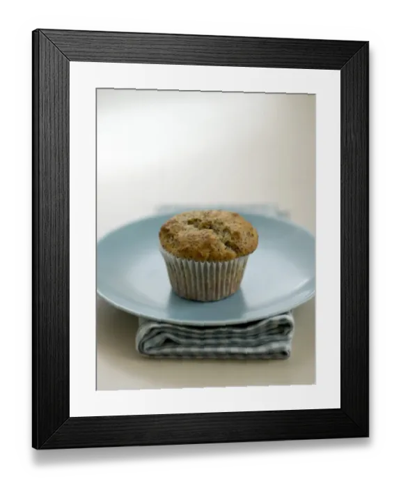 Framed Print : Single poppyseed muffin on blue plate on check napkin, on painted table. credit Framed Print : Single poppyseed muffin on blue plate on check napkin, on painted table. credit