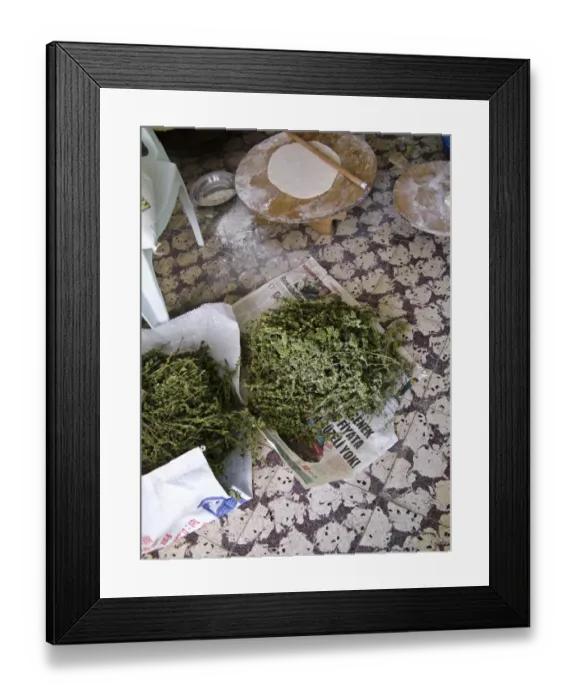 Framed Print : Large thin circle of bread on a round wooden board on floor of quayside bakery Framed Print : Large thin circle of bread on a round wooden board on floor of quayside bakery