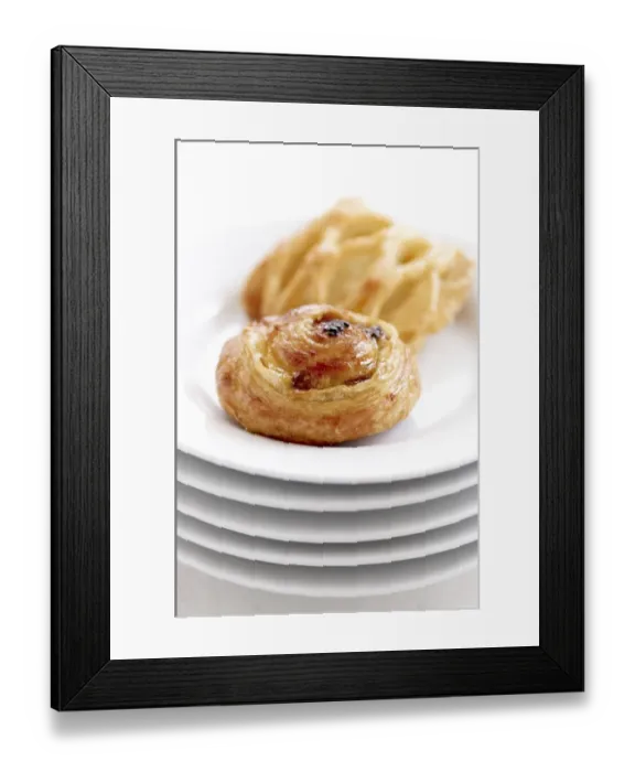 Framed Print : Small danish pastries on stack of white plates credit Framed Print : Small danish pastries on stack of white plates credit