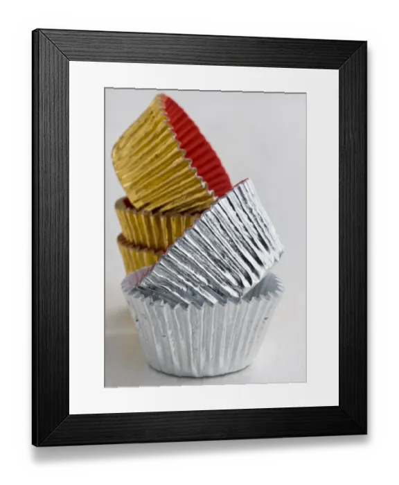 Framed Print : Stack of decorative metallic foil cake and muffin cases credit: Marie-Louise Avery Framed Print : Stack of decorative metallic foil cake and muffin cases credit: Marie-Louise Avery