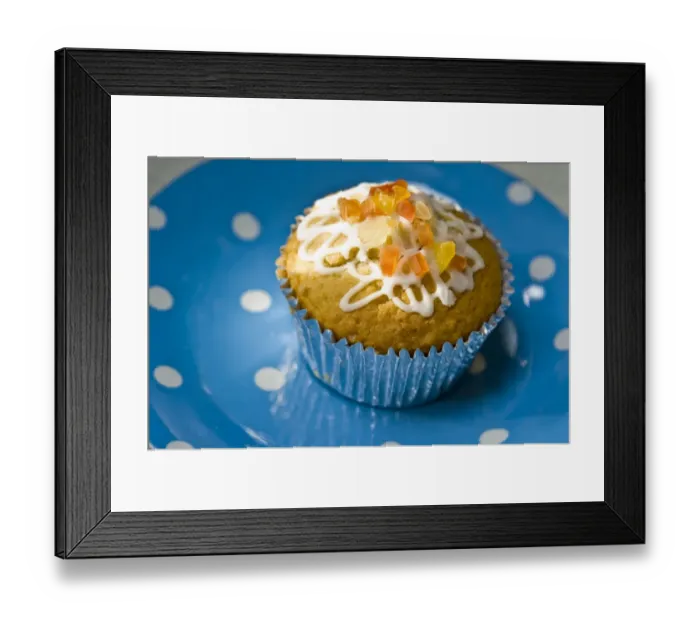 Framed Print : Muffin decorated with squiggly icing and candied peel on spotted blue plate credit Framed Print : Muffin decorated with squiggly icing and candied peel on spotted blue plate credit