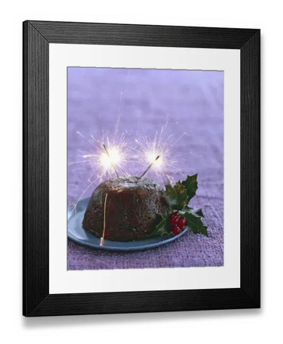 Framed Print : Traditional British Christmas pudding with with holly and berries and sparklers alight Framed Print : Traditional British Christmas pudding with with holly and berries and sparklers alight