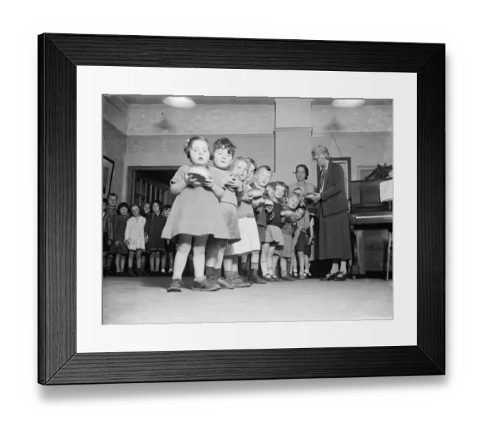 Framed Print : Young children receive their buns from the Guy Fawkes Charity. 1935 Framed Print : Young children receive their buns from the Guy Fawkes Charity. 1935