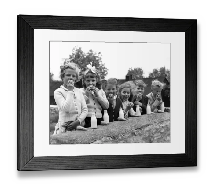 Framed Print : A group of children at the Chedworth, Gloucestershire, village school enjoy their