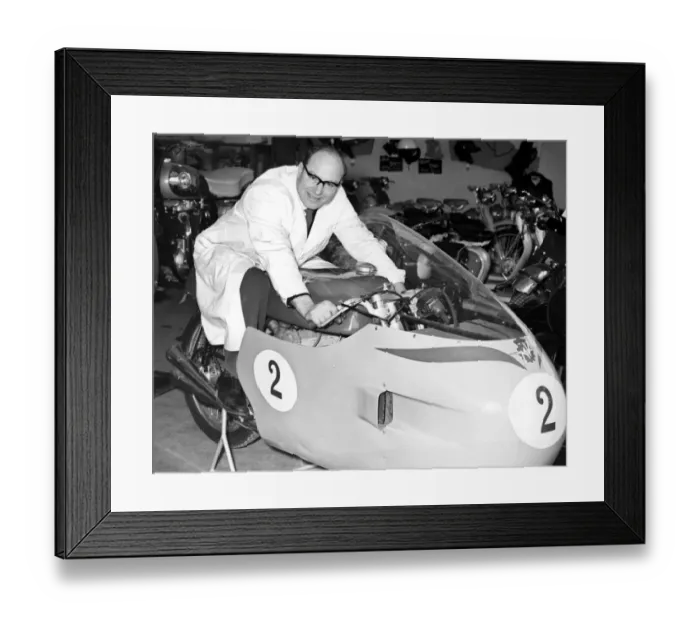 Framed Print : A mechanic sits astride John Surteess racing MV Augusta motorbike inside the Surtees Framed Print : A mechanic sits astride John Surteess racing MV Augusta motorbike inside the Surtees