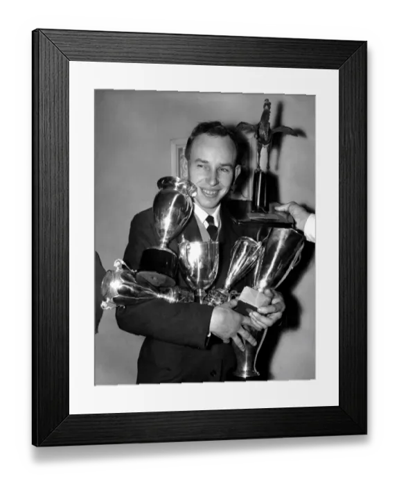 Framed Print : British Motorcycle World Champion John Surtees has both arms full of trophies already