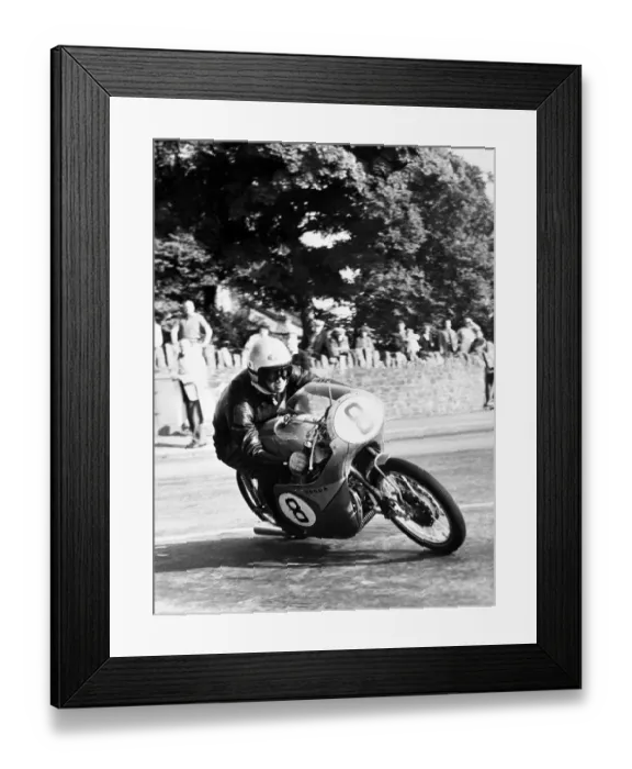 Framed Print : Isle of Man: N Taniguchi of Japan takes the corner at speed, riding a 125cc Japanese honda Framed Print : Isle of Man: N Taniguchi of Japan takes the corner at speed, riding a 125cc Japanese honda