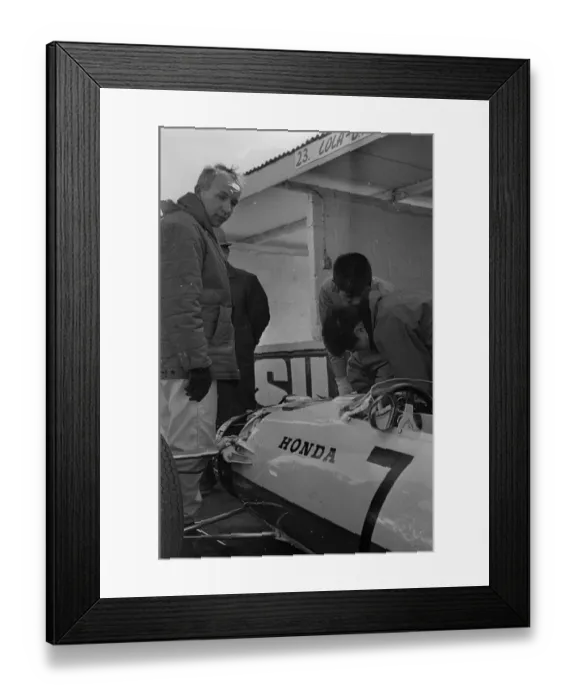 Framed Print : Japanese mechanics working on the suspension of John Surtees Honda car during testing Framed Print : Japanese mechanics working on the suspension of John Surtees Honda car during testing