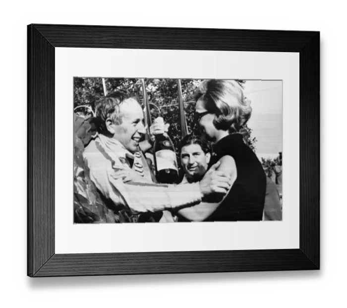 Framed Print : Monza Italy John Surtees is congratulated by Mrs Margherita Bandini widow of Lorenzo Bandini