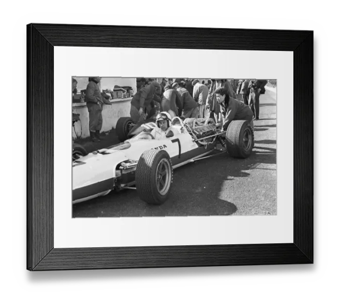 Framed Print : Japanese mechanic pushing John Surtees Honda car during testing at Brands Hatch Framed Print : Japanese mechanic pushing John Surtees Honda car during testing at Brands Hatch