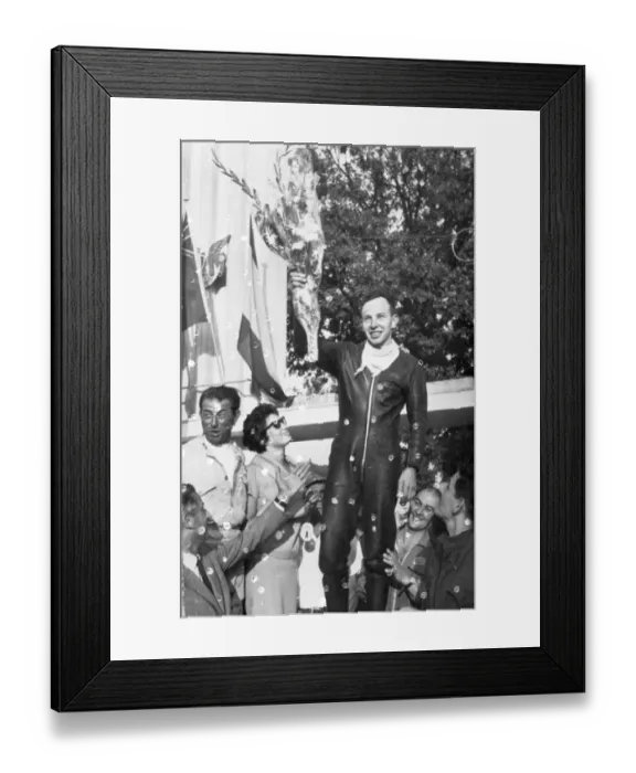 Framed Print : John Surtees acknowledges the cheers of the crowd after his second victory at Monza Italy