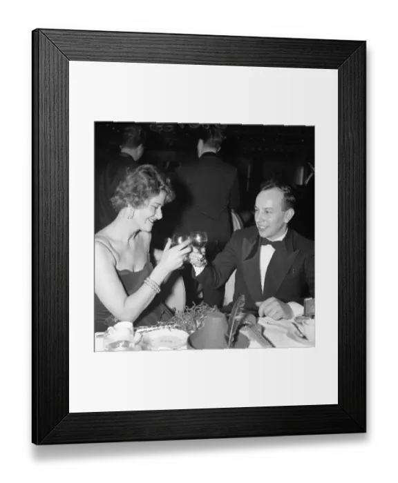 Framed Print : John Surtees drinks a toast with a friend as the old year passes at the Talk of