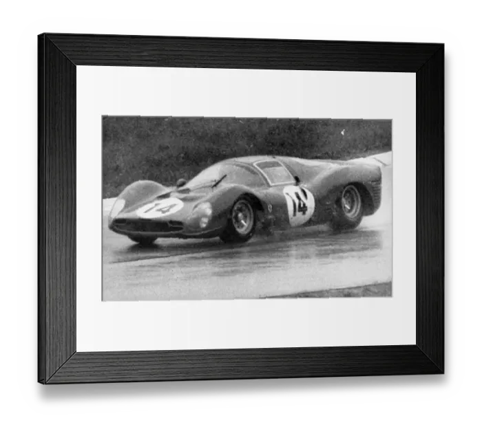 Framed Print : John Surtees pictured in action in heavy rain at the 1000 km Monza International race Framed Print : John Surtees pictured in action in heavy rain at the 1000 km Monza International race