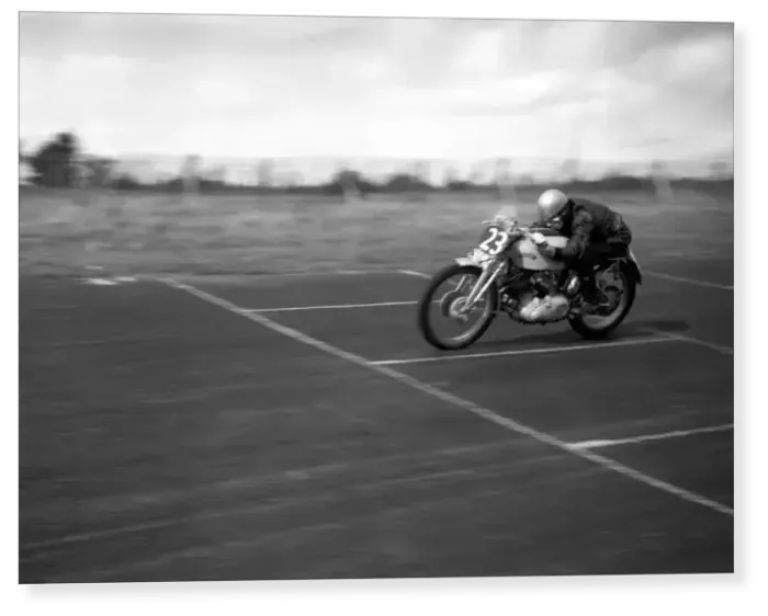 Print : John Surtees speeds over the finishing line at the race track on his Vincent motorbike