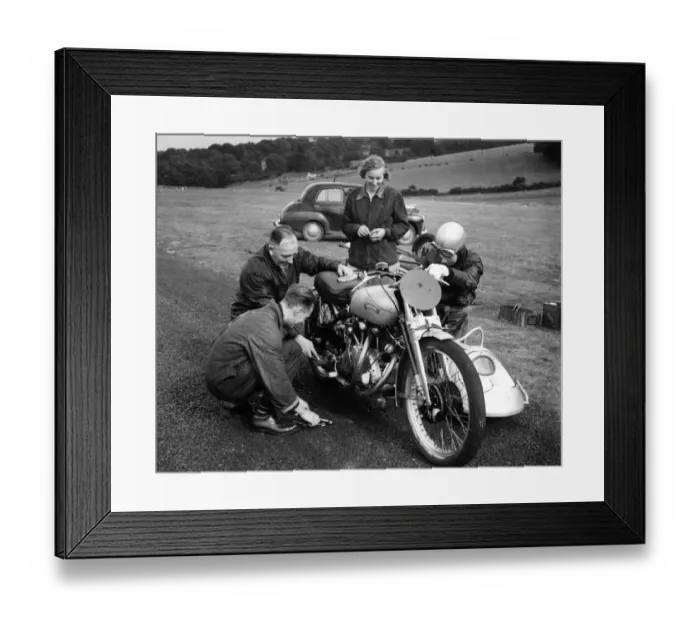 Framed Print : John Surtees and his family and friends get down to some motorbike maintenance at a race meeting Framed Print : John Surtees and his family and friends get down to some motorbike maintenance at a race meeting