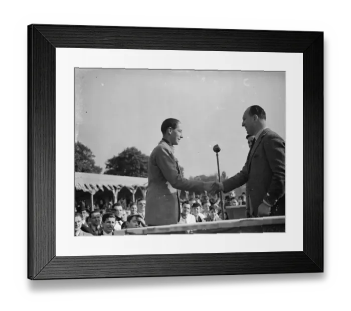 Framed Print : The Crystal Palace Road Racing. J H T Smith, the racing car driver, receiving Framed Print : The Crystal Palace Road Racing. J H T Smith, the racing car driver, receiving