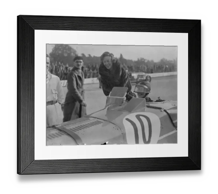 Framed Print : Woman driver at Brooklands autumn meeting. Miss D Evans ( standing ) talking to Mrs D G Evans