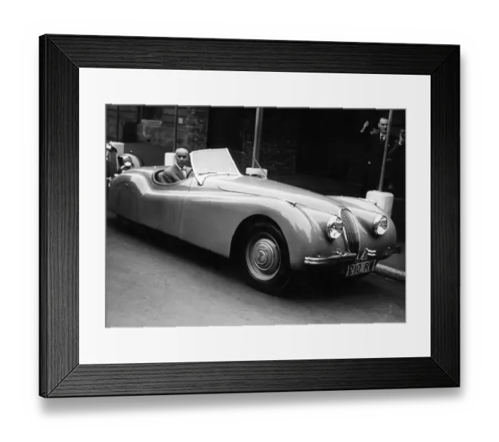 Framed Print : Tazio Nuvalari, the Italian motor racing veteran - seated at the wheel of the super