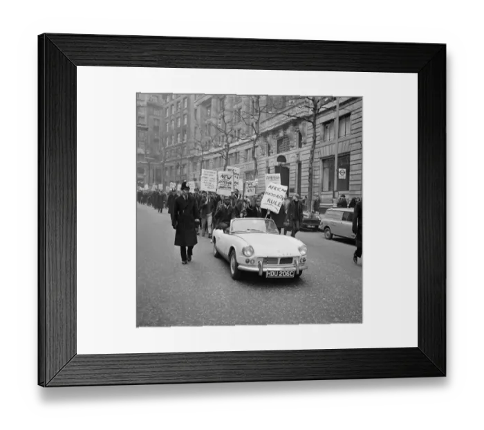 Framed Print : White and coloured students, displaying slogan carrying placards pictured during