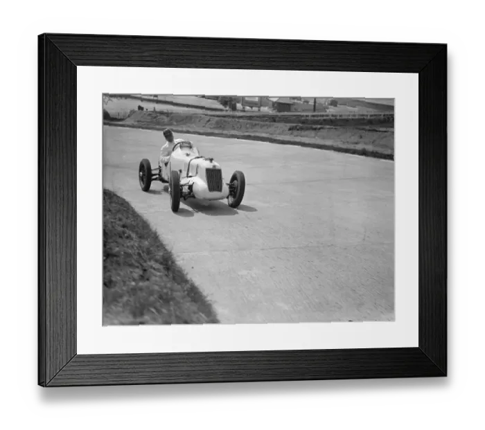 Framed Print : Driver, W Esplen in his supercharged MG taking the last hill on the new road track at Brooklands Framed Print : Driver, W Esplen in his supercharged MG taking the last hill on the new road track at Brooklands