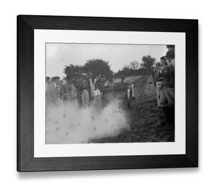 Framed Print : A car struggling up the track during a hillclimb event. 1935