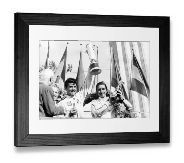Framed Print : Monza, Italy: Brian Redman and Jo Siffert hold aloft their trophies after winning the 1, 000 KMS