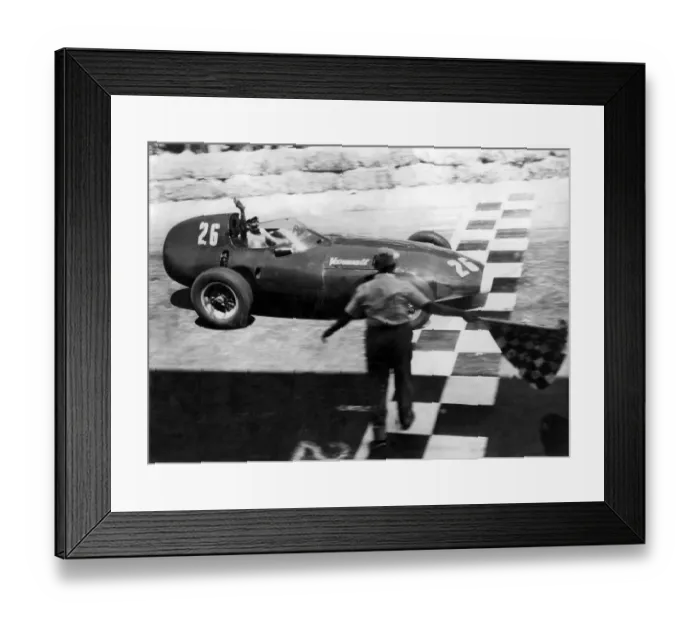 Framed Print : Stirling Moss raises his hand in salute as he crossed the chequered line to win Framed Print : Stirling Moss raises his hand in salute as he crossed the chequered line to win