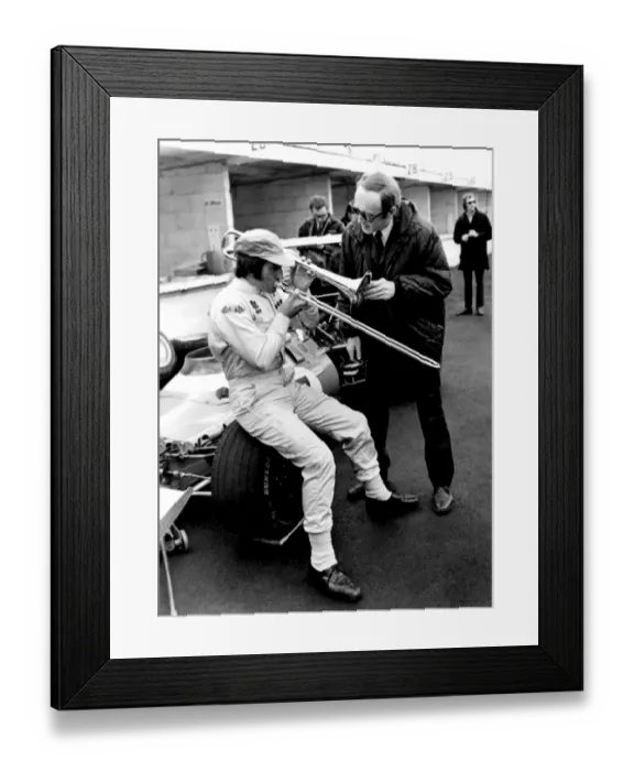 Framed Print : Brands Hatch, Kent: Racing driver Jackie Stewart, of Scotland, isn t really blowing